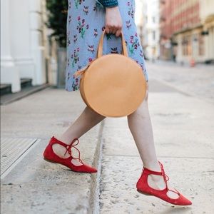 Red lace-up flats